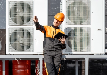 workman-servicing-air-conditioning-or-heat-pump-wi.webp